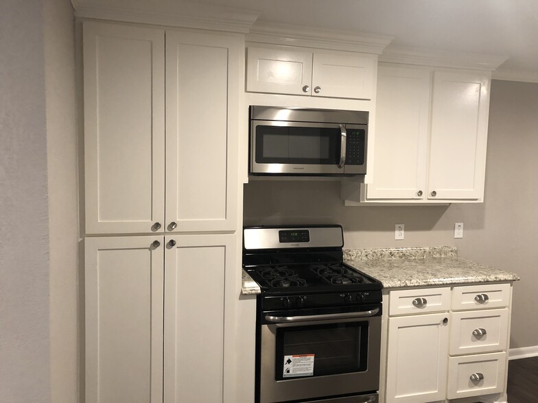 Kitchen gas range - 1822 Avenue M 1/2