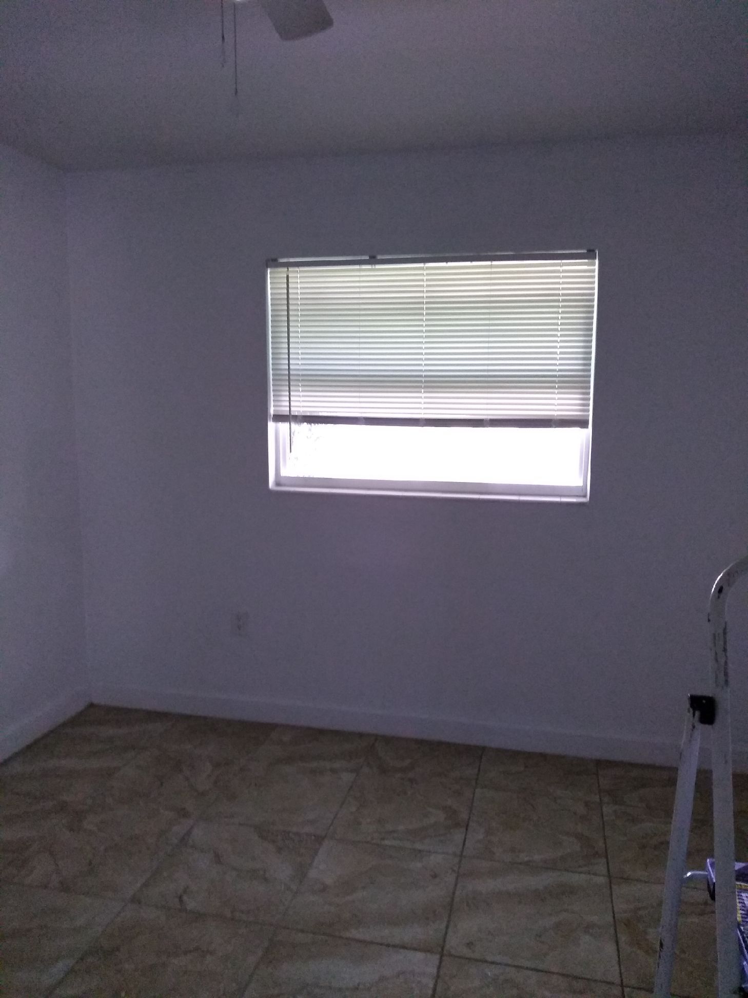 Bedroom has a fan/light and large window - 7105 Poinsetta Ave