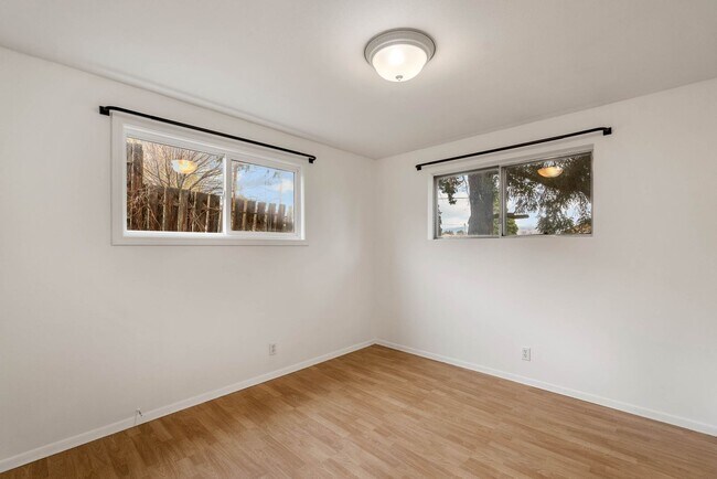 Building Photo - 4 Bedroom Home with Covered Parking & Fenced Backyard