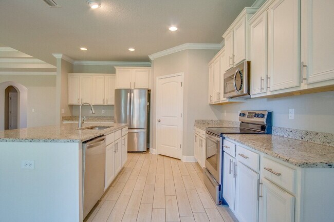 Building Photo - Spacious 4BR Pool Home with Modern Upgrade...
