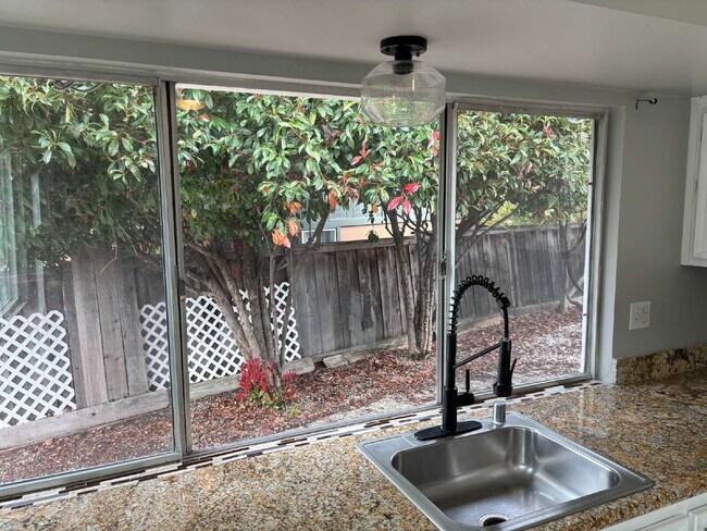 Building Photo - "Charming Concord Retreat: 3-Bedroom Gem with Granite Accents & Cozy Fireplace"