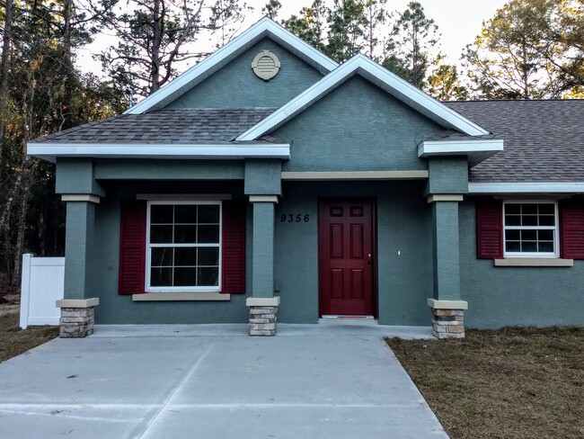 Front Door and Covered Porch - 9356 N Peachtree Way