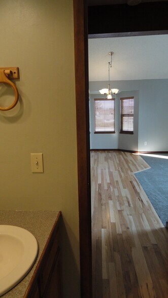 Main floor bathroom out to dining room/living room - 9705 W 97th Ave