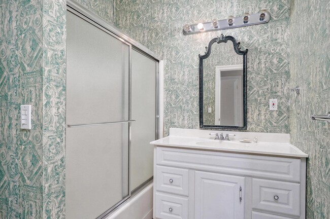 downstairs hall bath, new vanity and and mirror to be installed - 4907 S Buckingham Ln