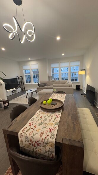 dining / living rooms are furnished with new table / sofa / tv - 3526 Margaret Jones Pl