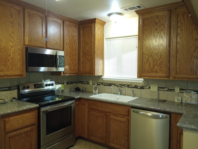 Kitchen stainless steel appliances - 215 Jennie St