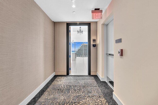 Building Photo - Stunning High-Rise Condo with Ocean Views | Prime Beach Location