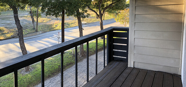 Bedroom balcony overlooks a green space - 8710 Park Ln