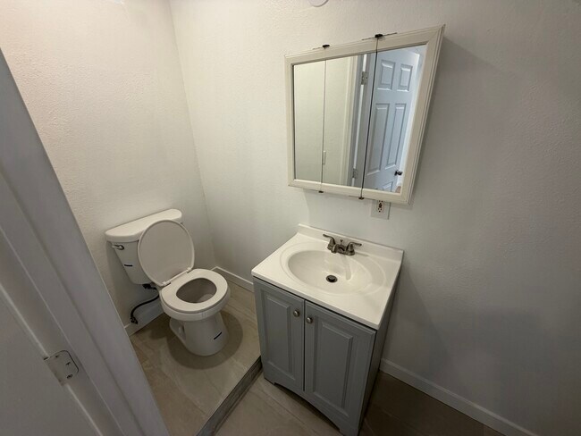 Downstairs Living Room 1/2 Bathroom - 1754 N Alexandria Ave