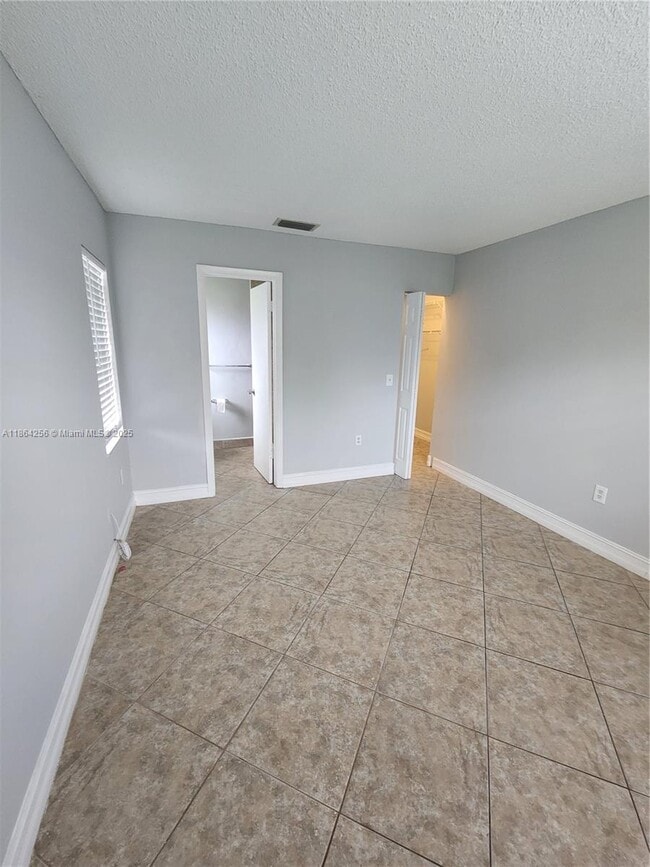 Building Photo - 10960 NW 29th Ct