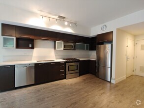 Building Photo - Open 2bdrm 1 bath with floor to ceiling wi...