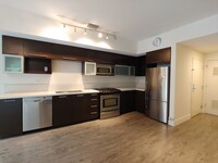 Building Photo - Open 2bdrm 1 bath with floor to ceiling wi...