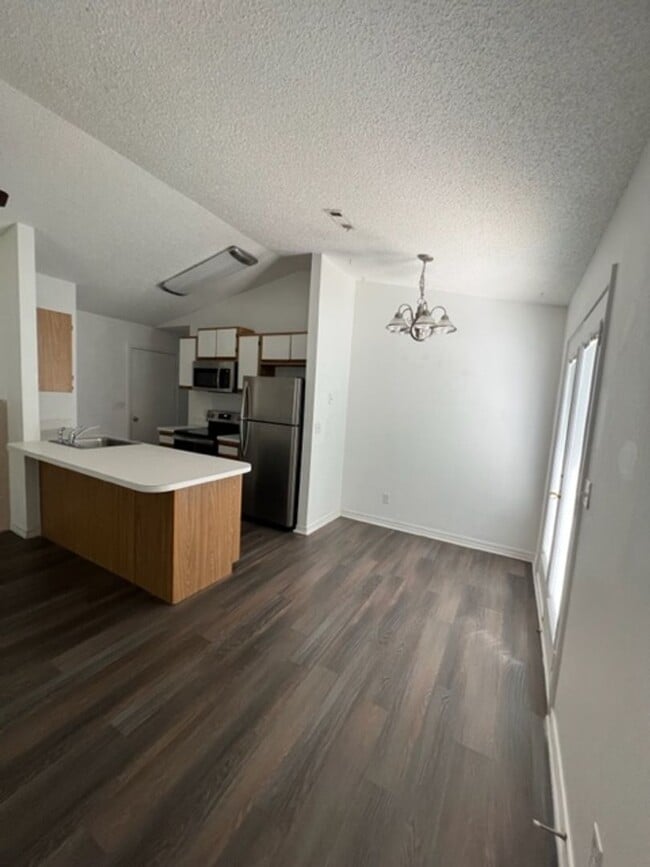 Building Photo - *Showings Begin Soon* Easy Living! 2BR/1.5BA with Garage & Lawn Care Included *No Pets*