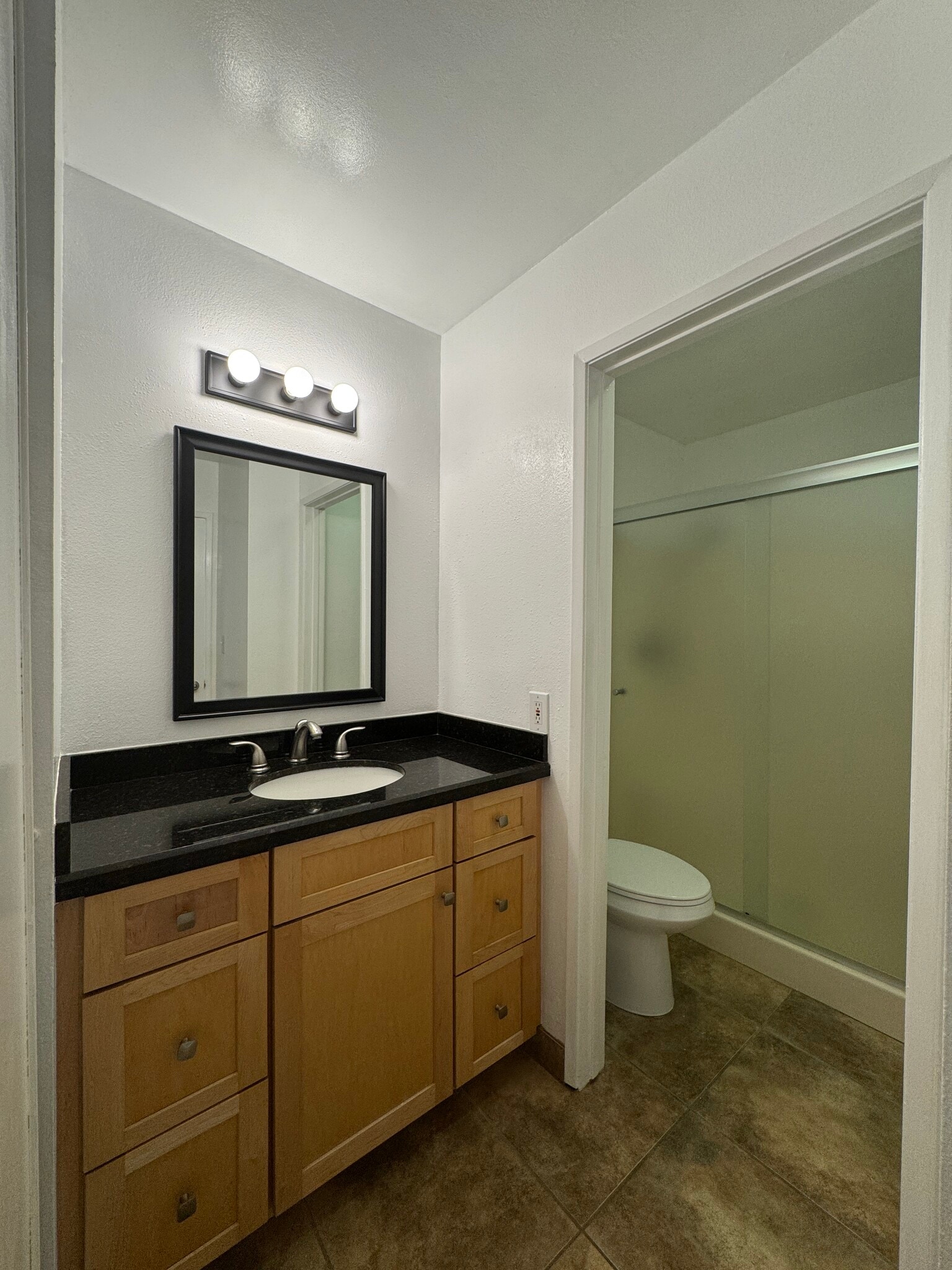 En-suite master bathroom with shower - 11112 Summertime Ln