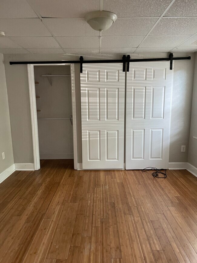 Closets with barn doors - 50 Kenmore Ave