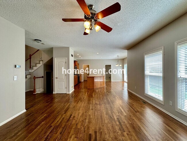 Building Photo - Beautiful Four-Bedroom Home with Three Car Garage, Wood Floors, Finished Basement and a Fenced Ya...