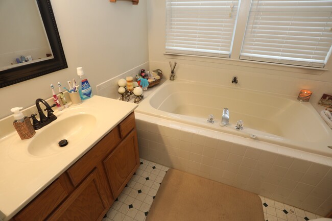 Building Photo - Available -Spacious 2 Car Garaged Townhome...