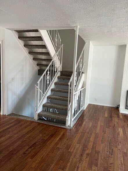 Main floor stairs. - 6396 E Mississippi Ave