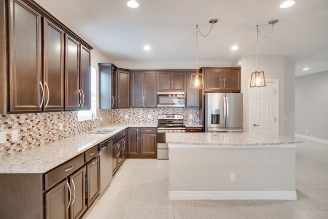 Building Photo - Stunning 3-Bedroom Pool Home with Bonus Room in the Gated Community of Lakeshore at Narcoossee