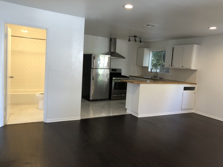 Living room facing kitchen - 719 N Formosa Ave