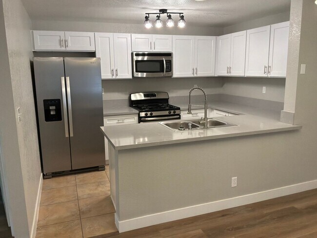 Building Photo - Condo 3 bedrooms 2 bathrooms 1 car garage gated subdivision.