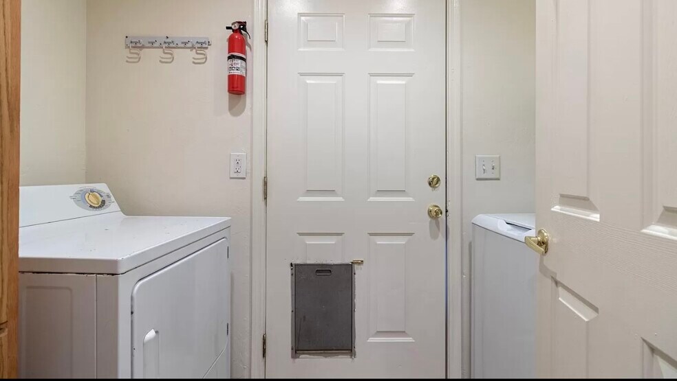 Laundry room with washer and dryer - 3138 E Adams St
