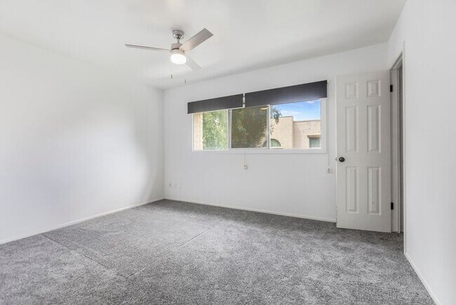 Building Photo - Discover this charming two-story townhome