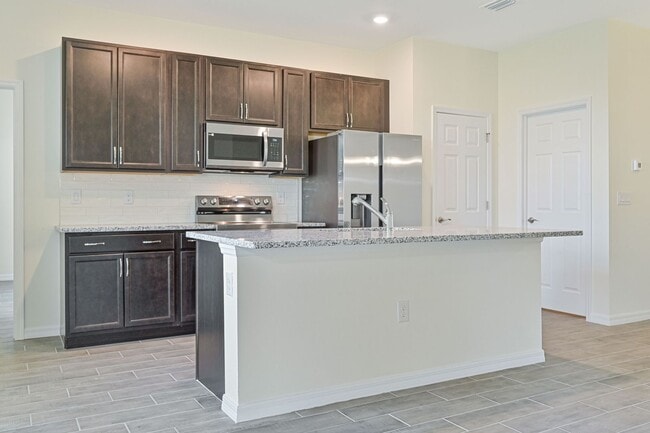 Building Photo - ** 3 + Den Home in NW Cape ~ 2 Car Garage **