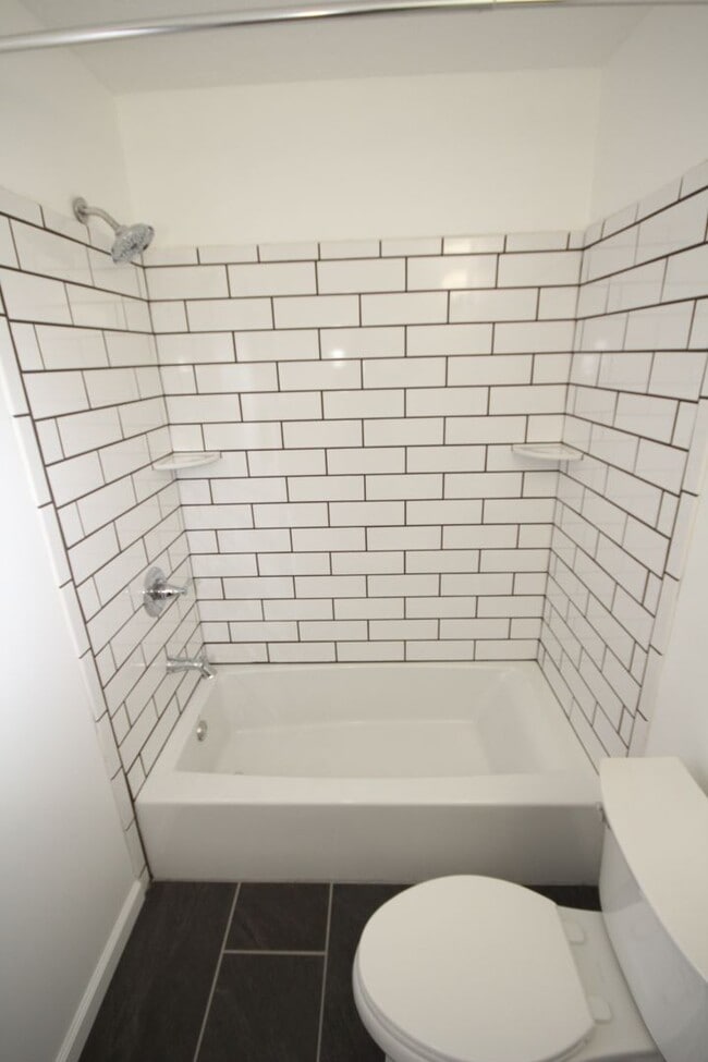 Building Photo - *Coming Soon*  Upgraded End Unit Townhome ...