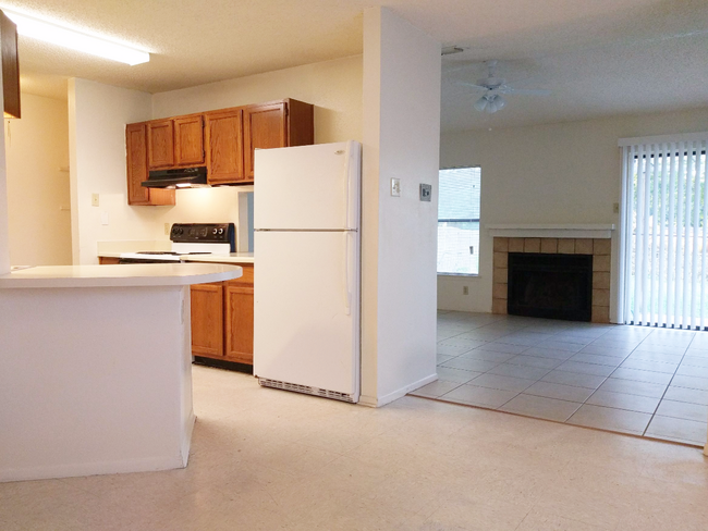 Kitchen to Living Room with a Kitchen Pass-Through/Breakfast Bar - 2527 Corian Glen Dr