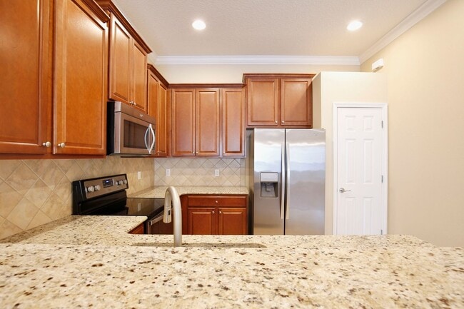 Building Photo - AGENT SHOWINGS ONLY! Gorgeous 2/2 + Den Mediterranean Villa with Waterfront Screened Patio and 2-...
