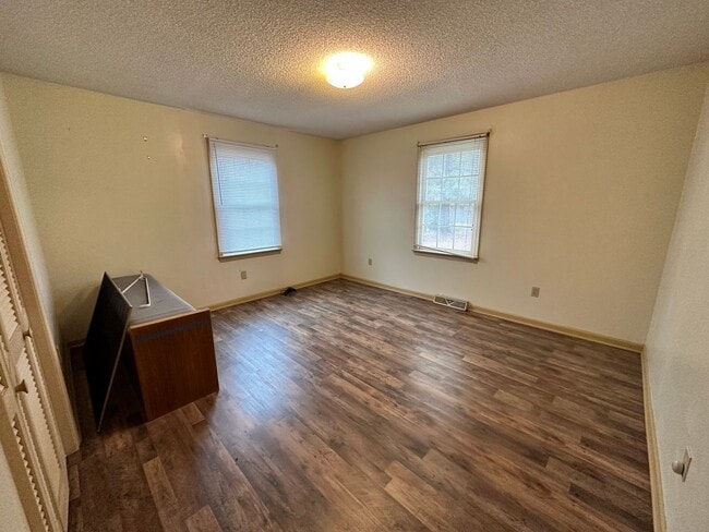 Building Photo - 4-Bedroom Brick Home with Full Unfinished ...