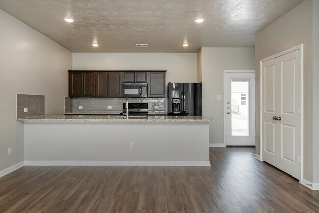 Building Photo - Live, love, and grow in this charming townhome!