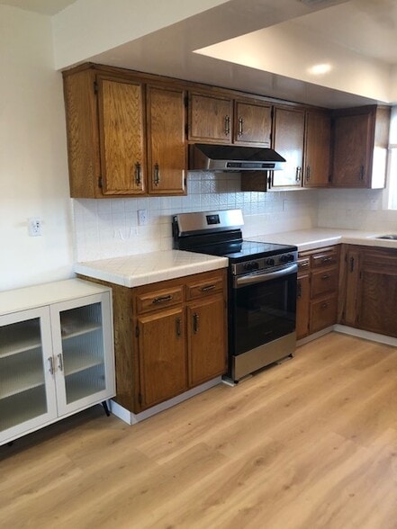 CUSTOM ASH CABINETS & NEW ELECTRIC STOVE - 8322 Mango Ave