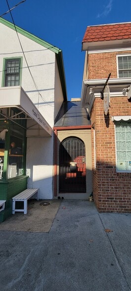Private Entrance with Gate in Front of Building - 20 W Main St