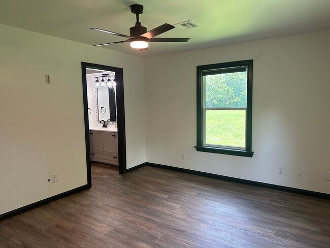 Building Photo - Welcome to country living with a fresh, modern twist.