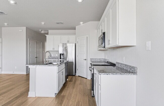 Building Photo - "Charming 3-Bedroom Duplex in San Antonio with Granite Elegance!"