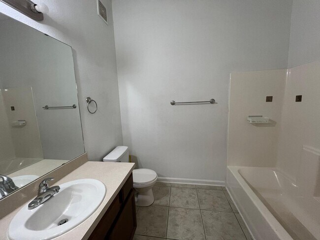 Building Photo - Spacious 3 bedroom condo located in a gated community off of Beach Boulevard