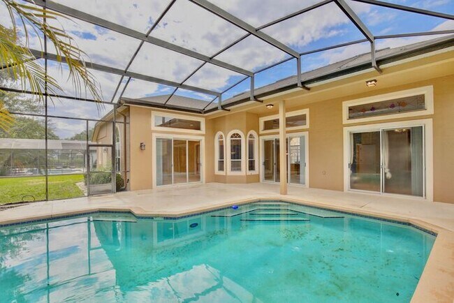 Building Photo - Stunning 4/3 Pool Home with a Bonus Room a...