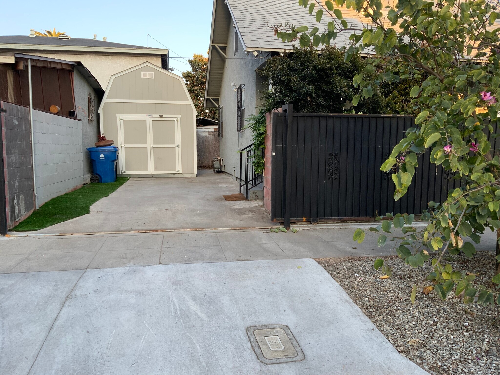 Inside the Driveway and view of Shed. - 5608 Naomi Ave