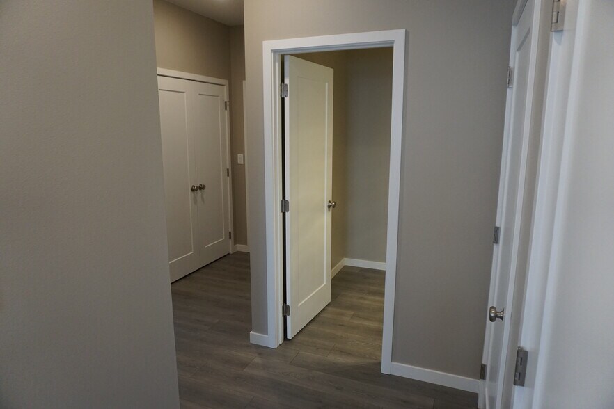 Off of the kitchen looking to the entry hallway (Photos are of similar unit with similar finishes.) - 3811 Stacy Drive