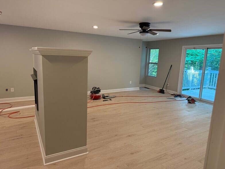 Open concept living room with fireplace - 4700 Dean Ct
