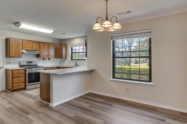 Building Photo - East Fayetteville 3-Bedroom Home with Granite Touches & Cozy Fireplace!"