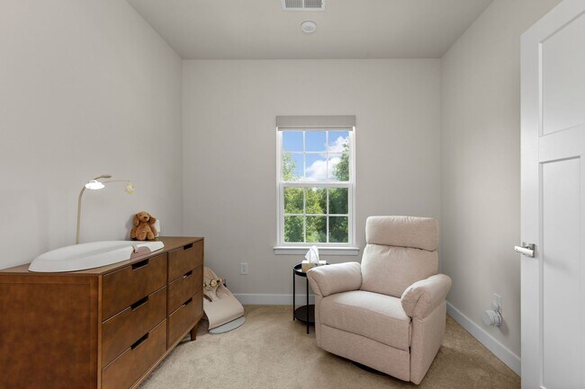 Building Photo - Luxurious three-story townhome with owner's suite and high-end finishes