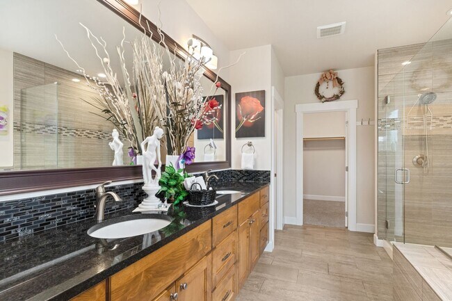 Building Photo - 3-bedroom, 2-bathroom home featuring an op...