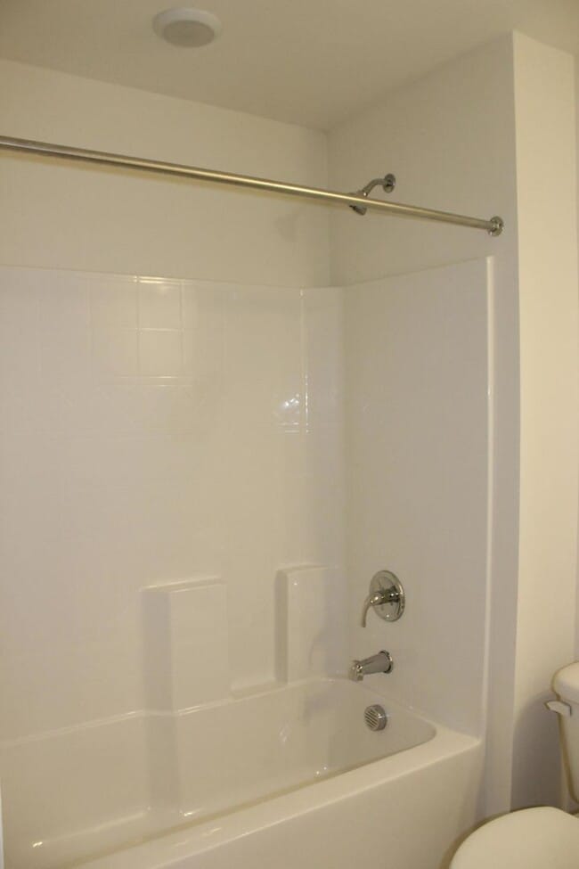 Building Photo - Sun-Filled 3-Story End-Unit Townhome with Fenced Yard, Storage & Resort-Style Pool