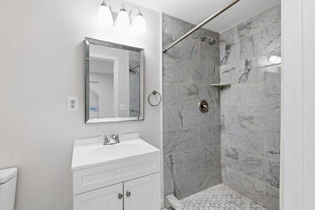 Building Photo - Experience contemporary living in this beautifully renovated residence where modern design meets ...