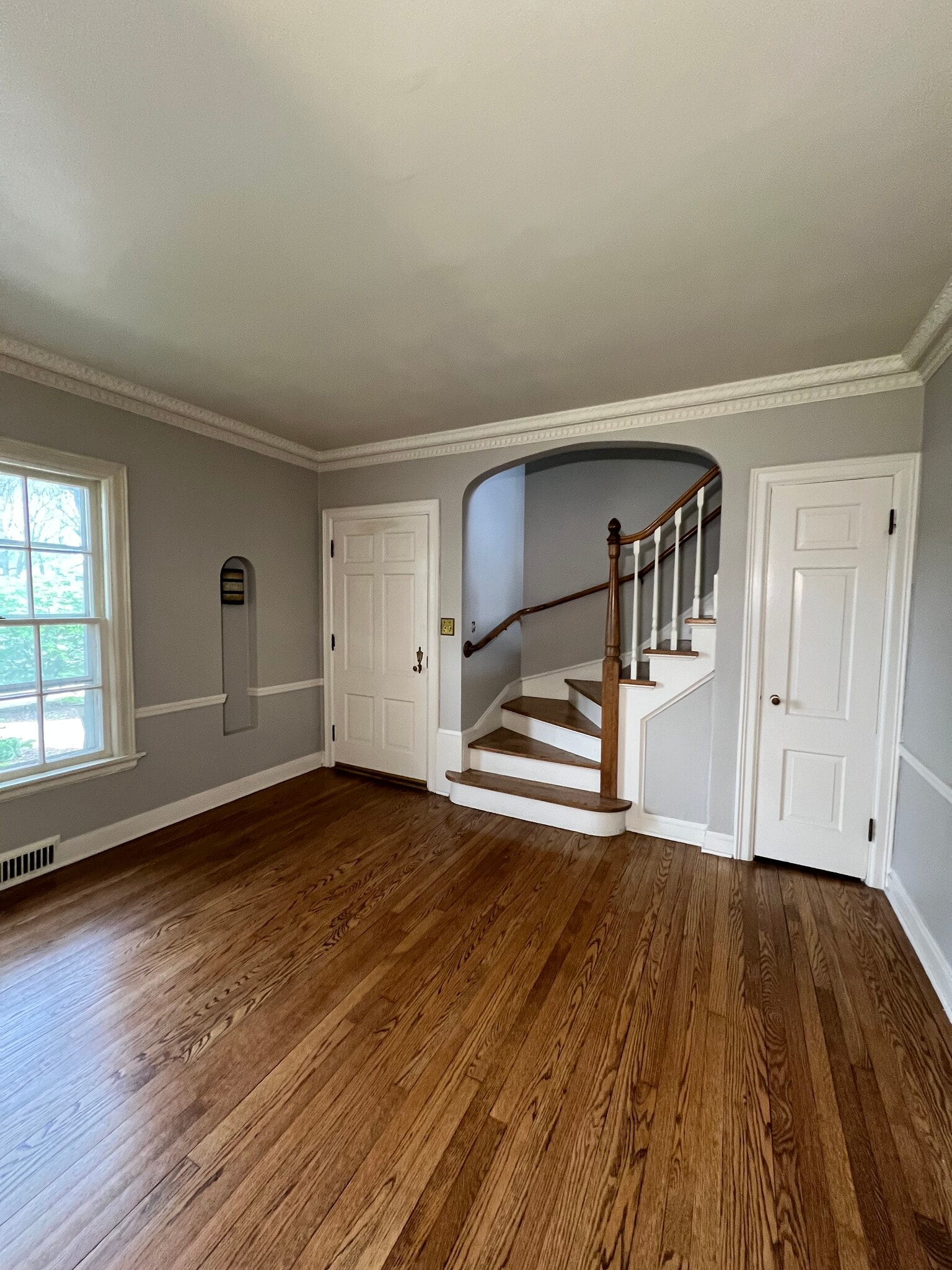 Front door into living room and stairs to upper bedrooms - 6407 W Lloyd St