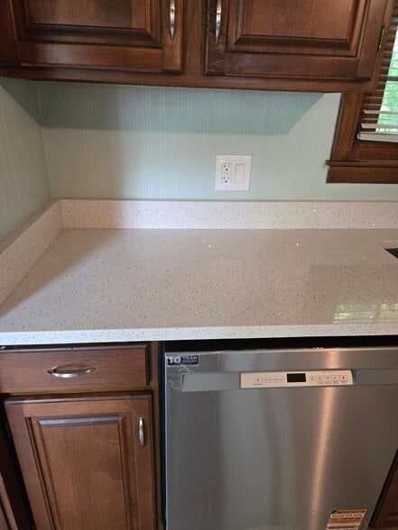 White quartz countertops & all new stainless steel appliances - 1280 S Beech St