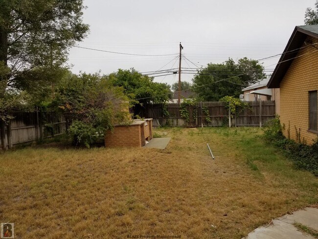 Building Photo - Massive Corner-Lot Home with Retro Charm & Shady Backyard!